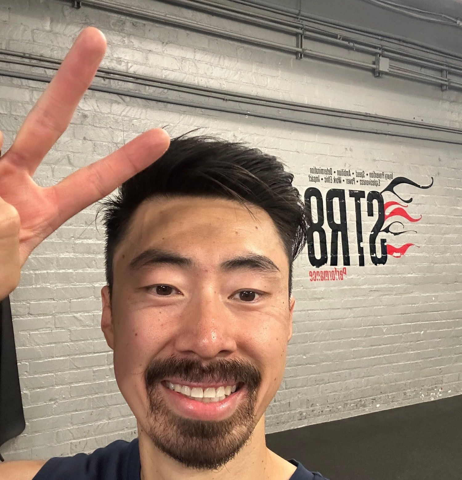 Dr. Michael Yip taking a selfie in a STR8 shirt